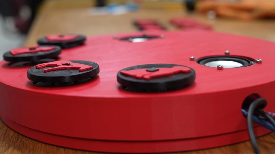 A 3d printed music player with large animal-themed buttons.