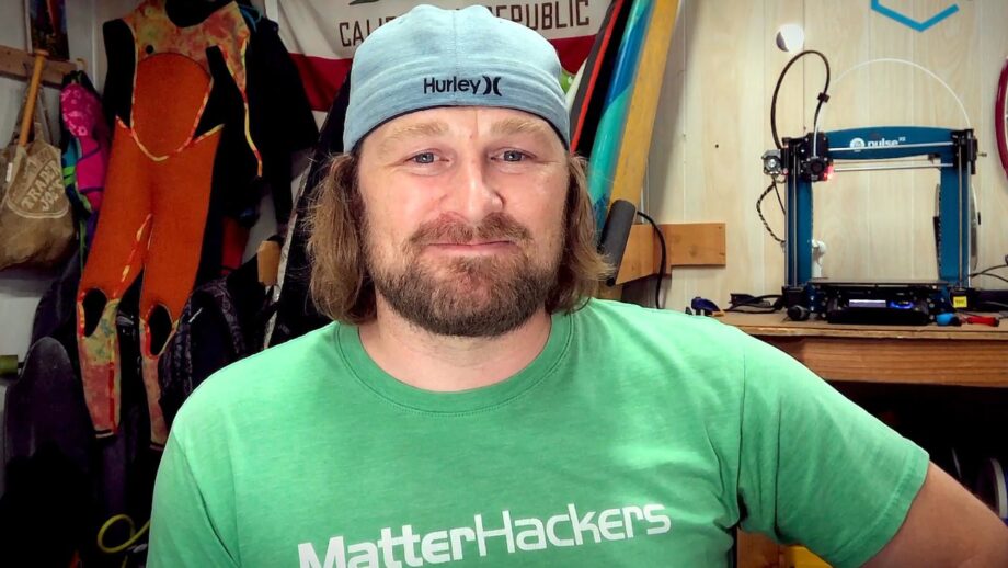 Man smiling, wearing a green Matterhackers t-shirt.