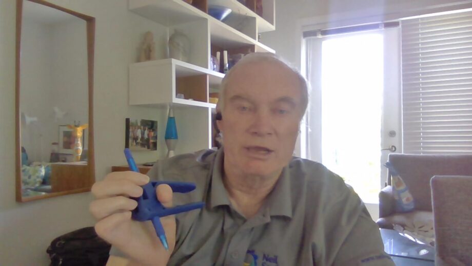 Gary holding a 3D printed assistive writing device