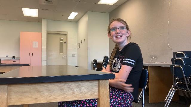 Make:able Champion, Michelle, sat at a table.