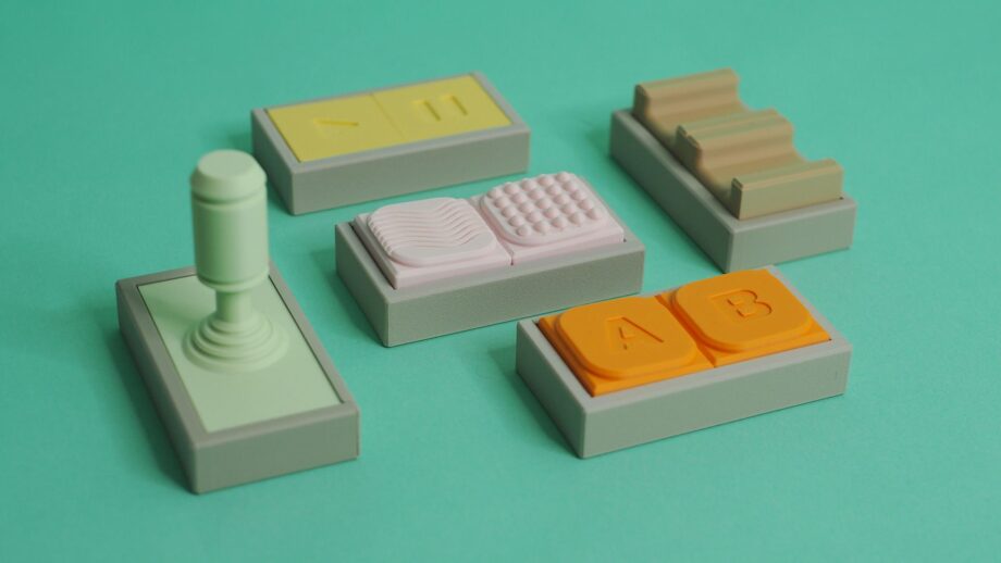 A set of brightly coloured 3D printed dual switch buttons.